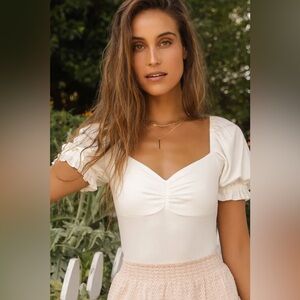 Romantic inclination ivory ribbed knit puff sleeve bodysuit